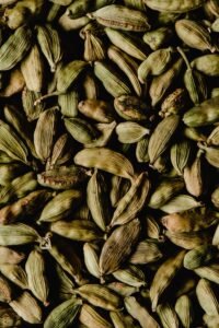 Pile of fresh green cardamom pods used to produce bulk cardamom essential oil