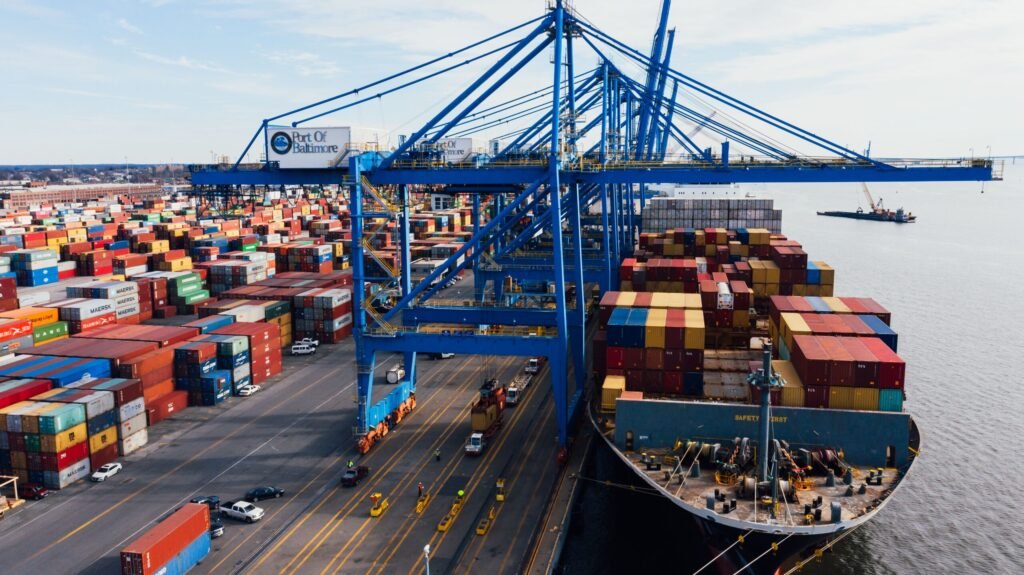 Cargo containers being unloaded at port for a bulk eucalyptus oil export shipment