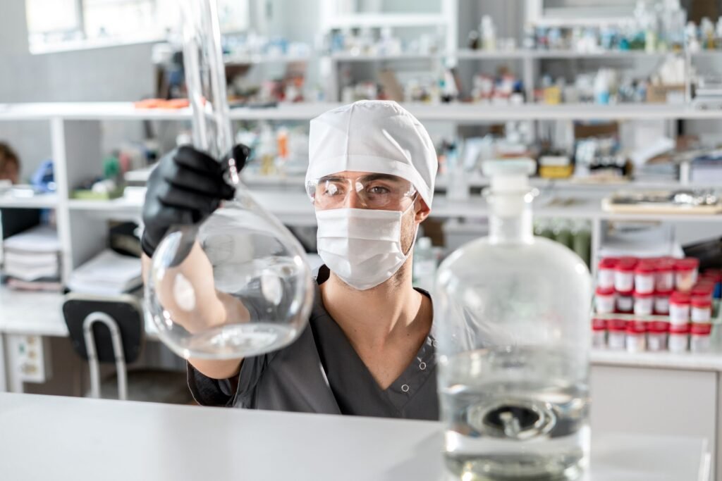 Laboratory chemist testing a cajeput oil sample for GC-MS documentation