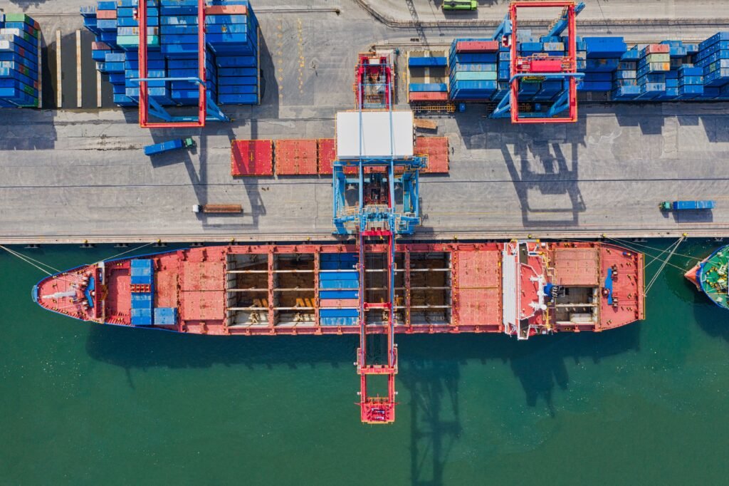 Aerial view of a shipping port handling bulk essential oil export containers bound for Chile