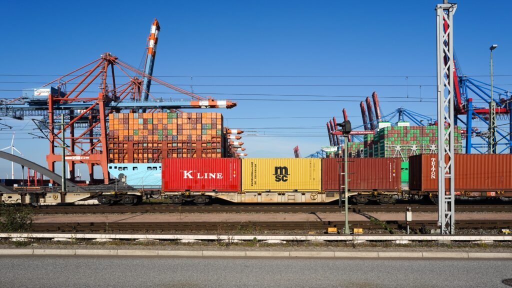 Shipping containers and cranes at an export port for bulk essential oil shipments to China