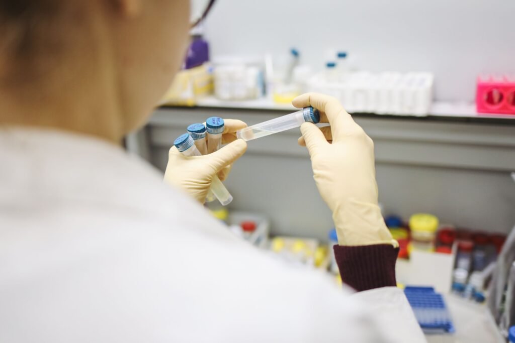 Laboratory analyst testing an essential oil sample for a Certificate of Analysis and GC/MS report