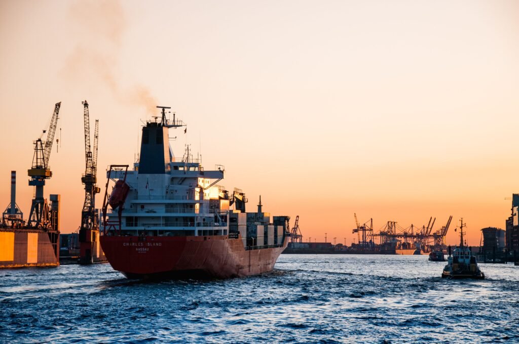 Cargo ship carrying shipping containers, representing the sea freight route used to import bulk essential oils into Mexico