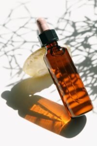 Amber glass bottle of bulk citronella essential oil for export
