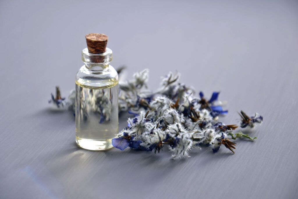 Essential oils for hand sanitizer and surface cleaner formulations: bottle with dried lavender flowers
